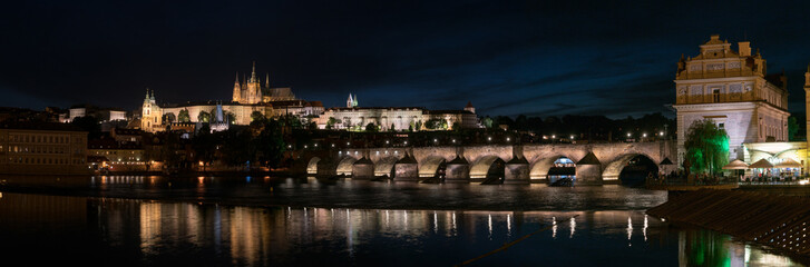 Panorama of Prague with Vltava river in the foreground, Charles Bridge on right and St. Vitus...