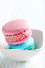 Tasty french macarons on a blue wooden table
