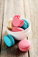 Tasty french macarons on a grey wooden table