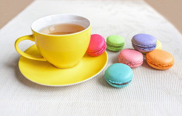 Obraz na płótnie Canvas Cup of tea with macaroon.
