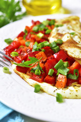 Omelette stuffed with bell pepper and carrot.