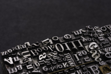 Metal Letterpress Types.
A background from many historic typographical letters in black and white with white background. - obrazy, fototapety, plakaty