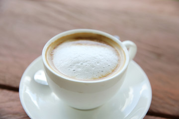 cappuccino coffee on wood background