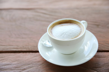 cappuccino coffee on wood background