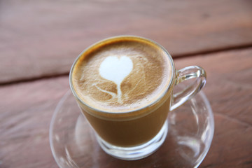 cappuccino coffee on wood background