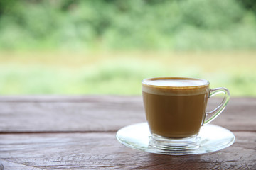 cappuccino coffee on wood background