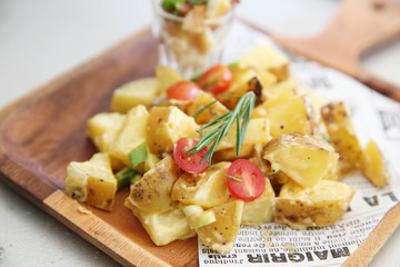 potato salad on wood background