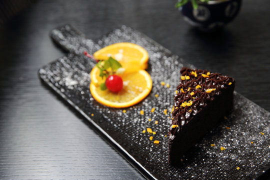 Dessert Food Orange Chocolate Cake On Wood Background