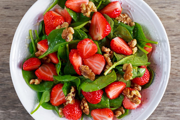 Summer Fruit Vegan Spinach Strawberry nuts Salad. concepts health food