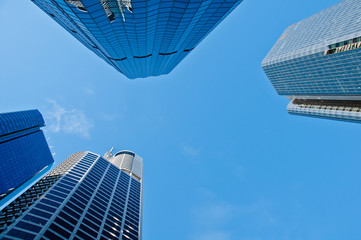 Fototapeta na wymiar Look up to skyscraper office buildings