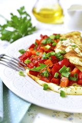 Omelette stuffed with bell pepper and carrot.