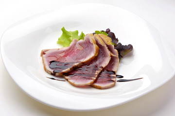 appetizer of grilled tuna slices with balsamic vinegar