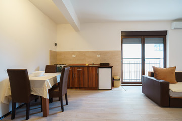 Interior of a guest house room with kitchen