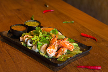 Fototapeta na wymiar Spicy seafood combination on table backgrounf 