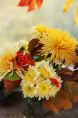 Beautiful autumn bouquet with chrysanthemums flowers, on windowsill
