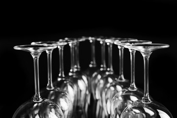 Empty wine glasses on black background, closeup