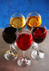 Glasses with wines of different colors on a table