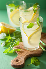 fresh lemonade drink with mint in glasses