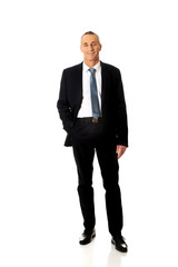 Businessman with hand in pockets