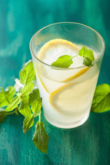 fresh lemonade drink with mint in glasses