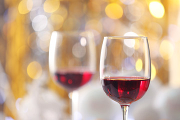 Wineglasses on blurred lights background