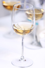 Wineglasses on light blurred background