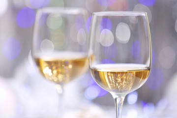 Wineglasses on light blurred background