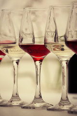 Wine glasses with red and white wine, closeup