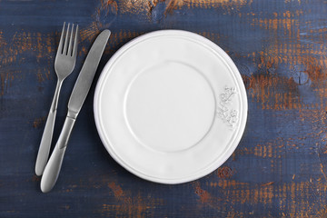 Set of dinnerware on wooden table