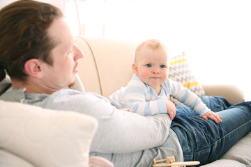 Young father having fun with his little son