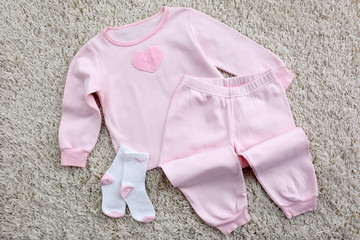 Baby clothes on light background