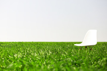 White wooden chair on the wheat field