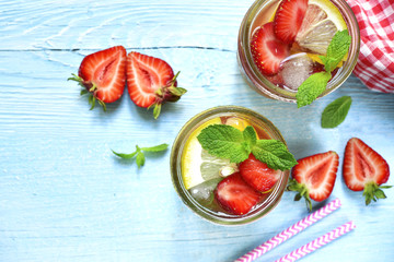 Strawberry lemonade with lemon and mint in a mason jar.Top view.