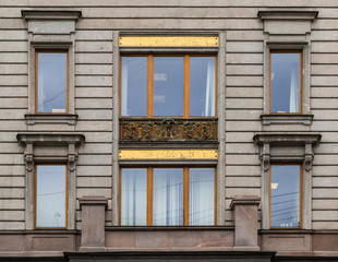 Fototapeta na wymiar Several windows in a row on facade of Singer House front view, St. Petersburg, Russia
