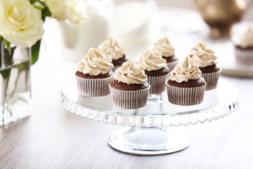 Tasty cupcakes on stand