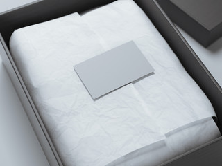 Black box with wrapping paper and business card. 3d rendering