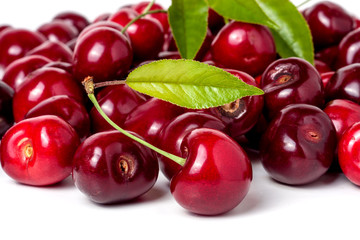 red cherry with leaf isolated on white background