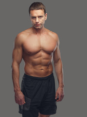 Fototapeta premium Shirtless male isolated on grey background.