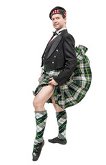 Scottish man in traditional national costume with blowing kilt © darkbird