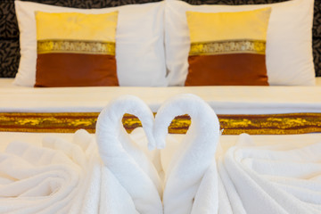 Hotel bed with towels