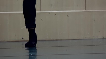 Feet of the classical male ballet dancer in the workout.  