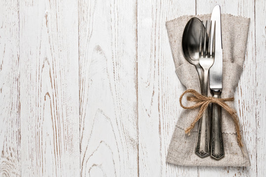 Silverware with an empty tag on a table