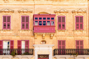 Facade with colorful balcony and shutters, Mdina, Malta