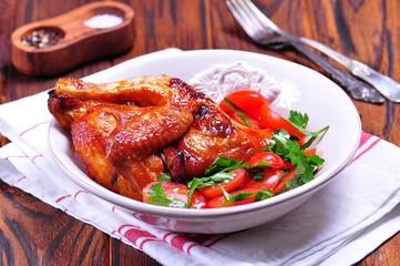 Grilled chicken and salad from cherry tomatoes and parsley
