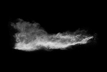 Fototapeta na wymiar White powder explosion isolated on black background