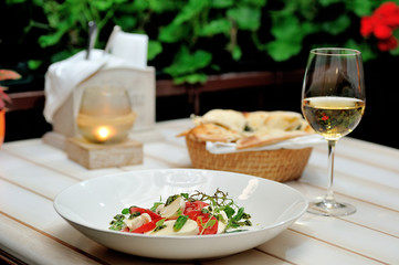 the Italian restaurant menu dish Caprese on the white plate