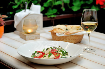the Italian restaurant menu dish Caprese on the white plate