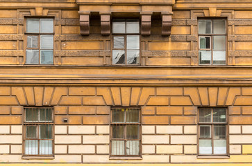 Several windows in a row on facade of the Saint-Petersburg University of Economics front view, St. Petersburg, Russia
