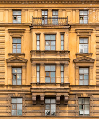 Several windows in a row and bay window on facade of the Saint-Petersburg University of Economics front view, St. Petersburg, Russia