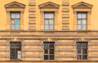 Several windows in a row on facade of the Saint-Petersburg University of Economics front view, St. Petersburg, Russia